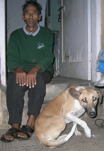 Birender with one of the street dogs he feed